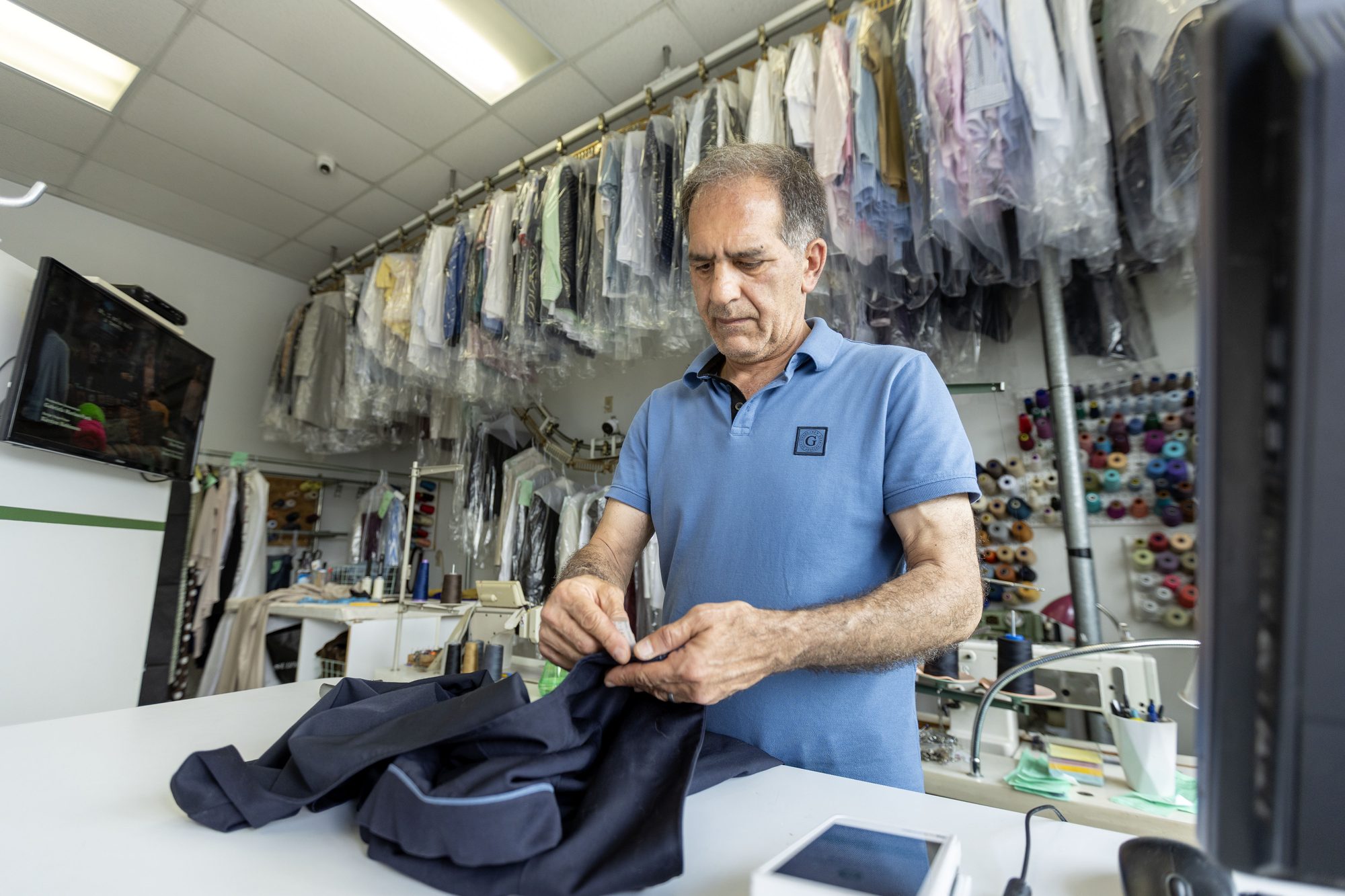 The owner of Sunny Dry Cleaners at work